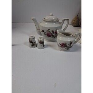 vintage white porcelain tea set featuring a pink moss rose floral pattern